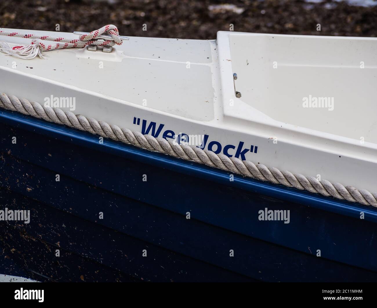 'Wee Jock' , name on side of a small motorboat Stock Photo