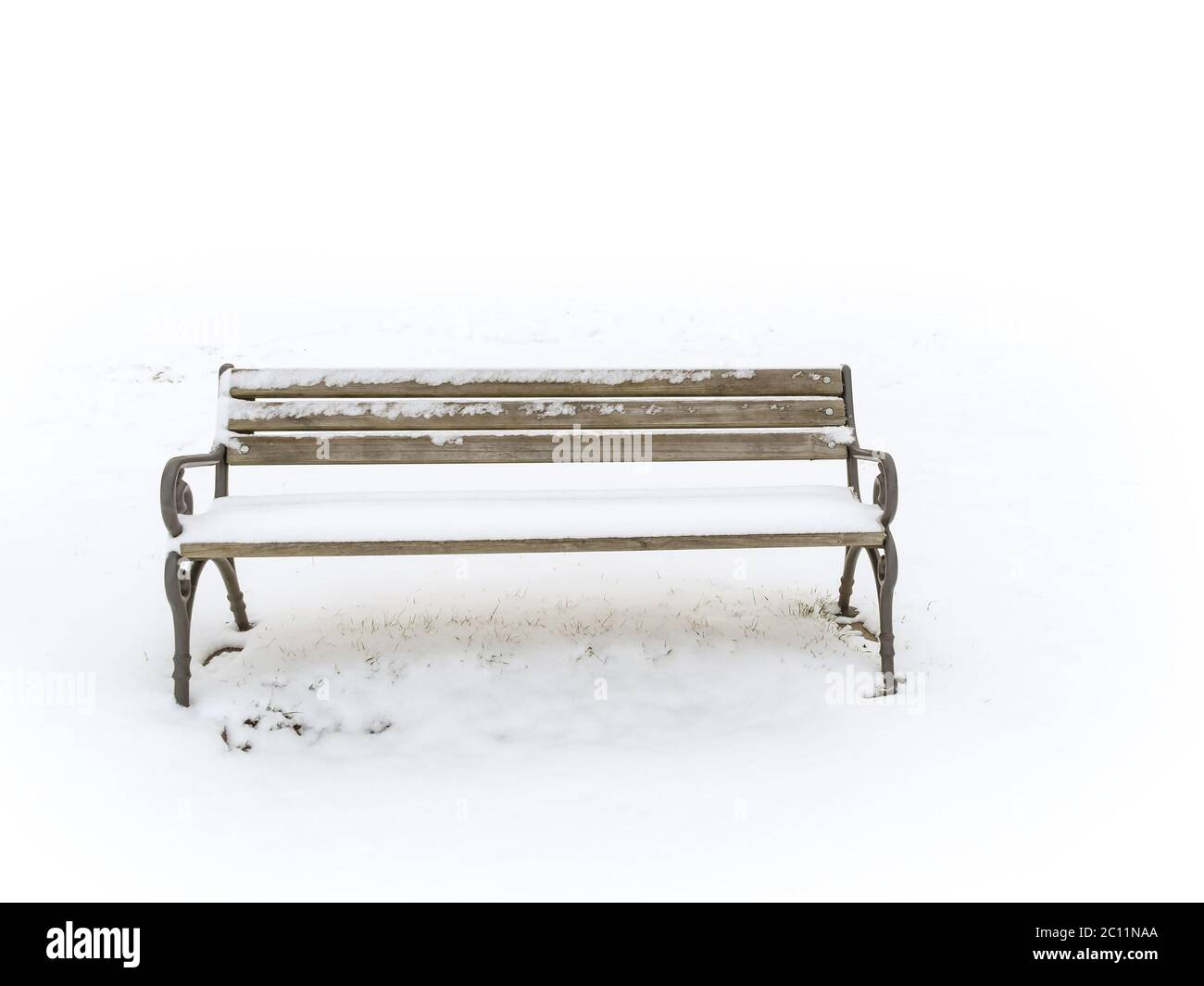 bench in a snowy winter senery Stock Photo
