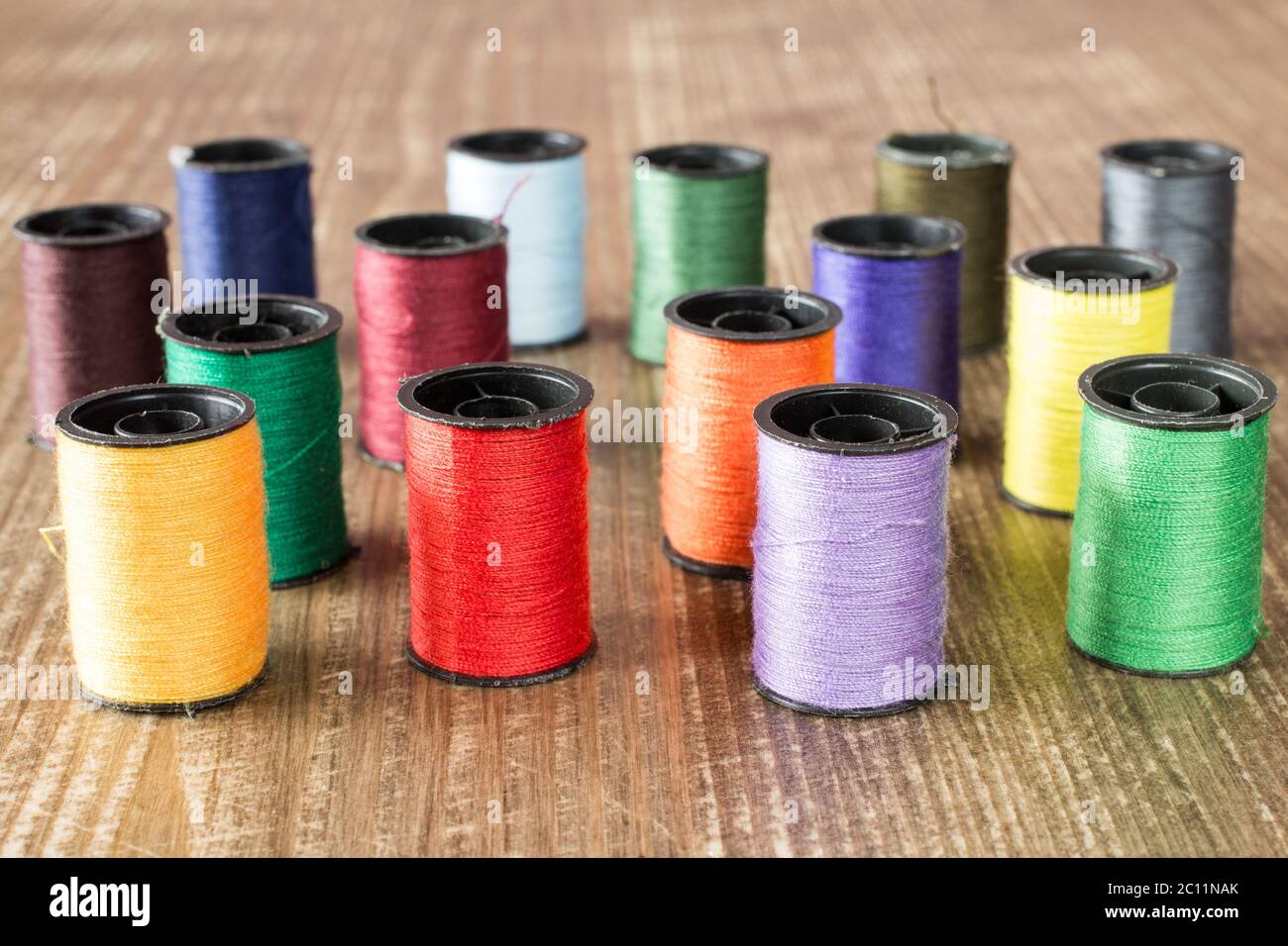 Bobbins with colorful threads Stock Photo - Alamy