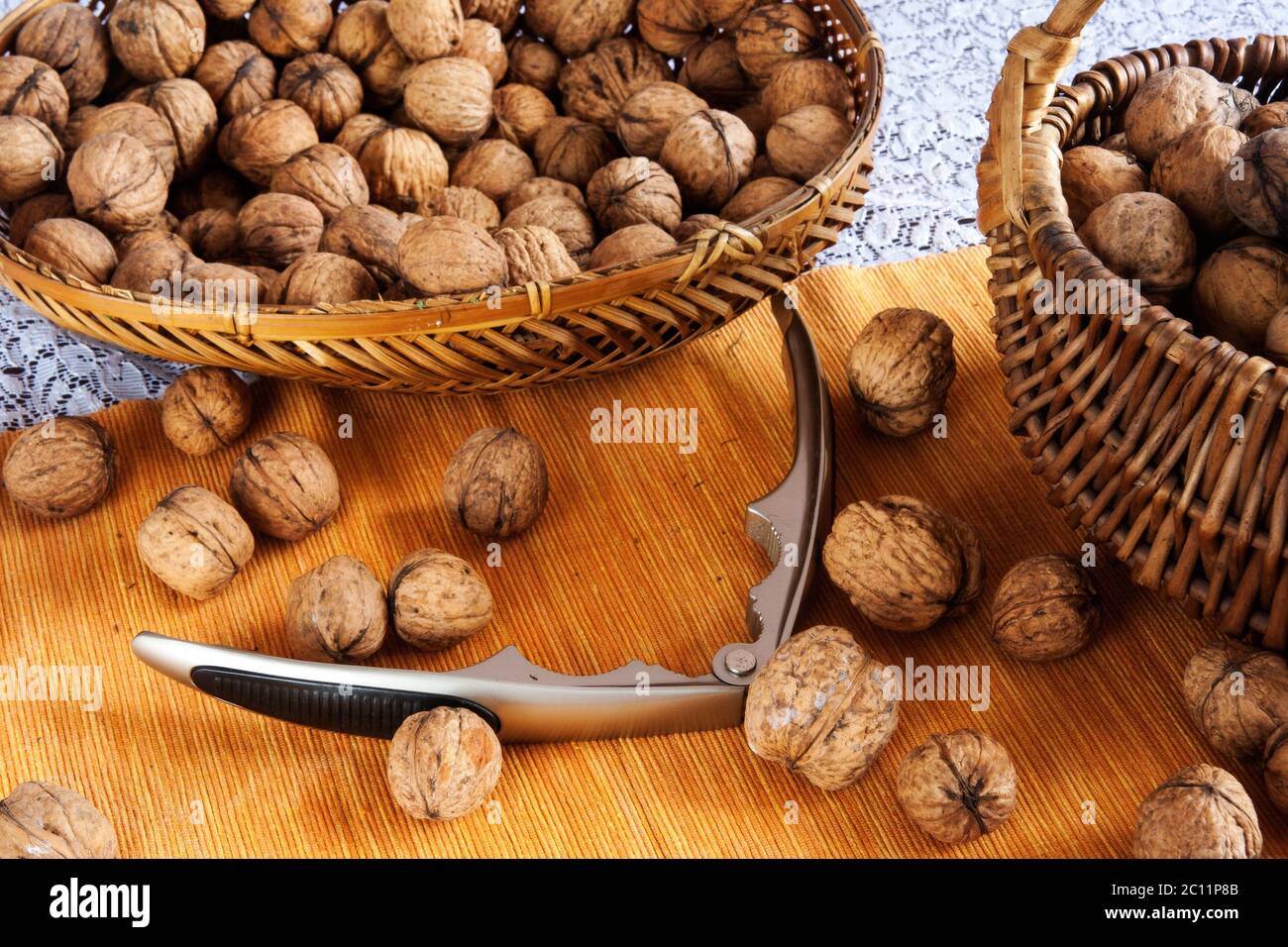 Tasty walnuts composition on table with blue tablecloth Stock Photo