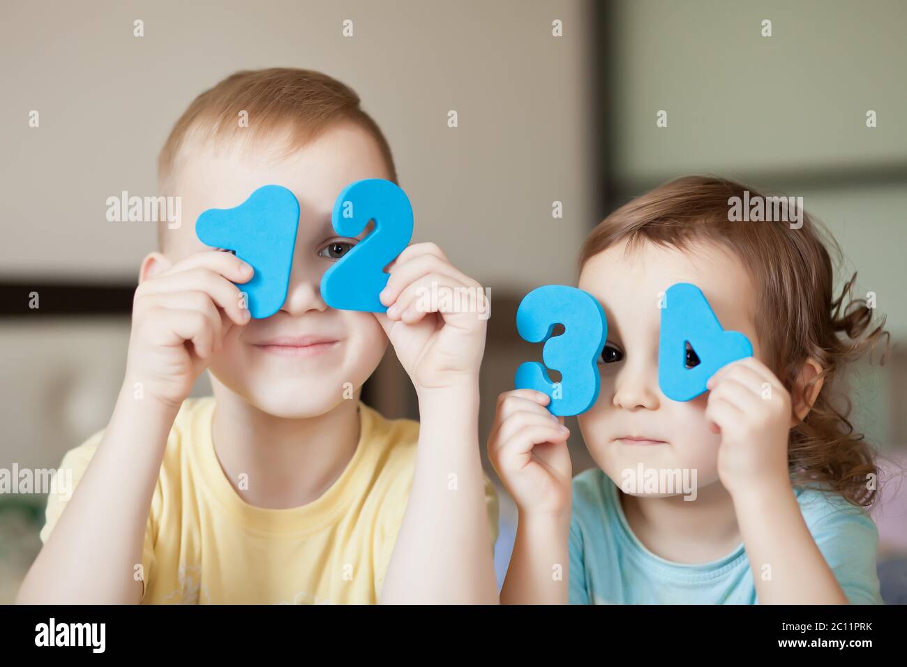 Educational colorful numeral figures in a child hands. Teaching ...
