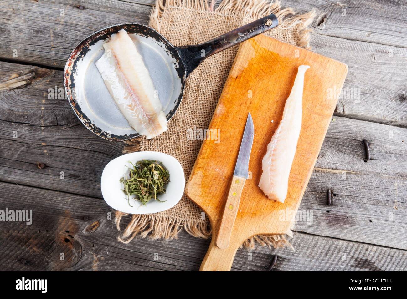 raw fish fillets for frying on pan. kitchen composition Stock Photo - Alamy