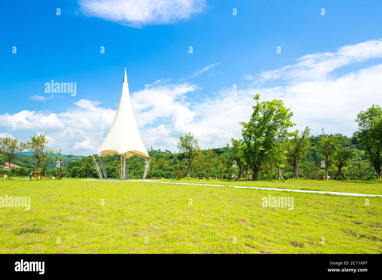 architecture with sharp roof in beautiful park in blue sky Stock Photo