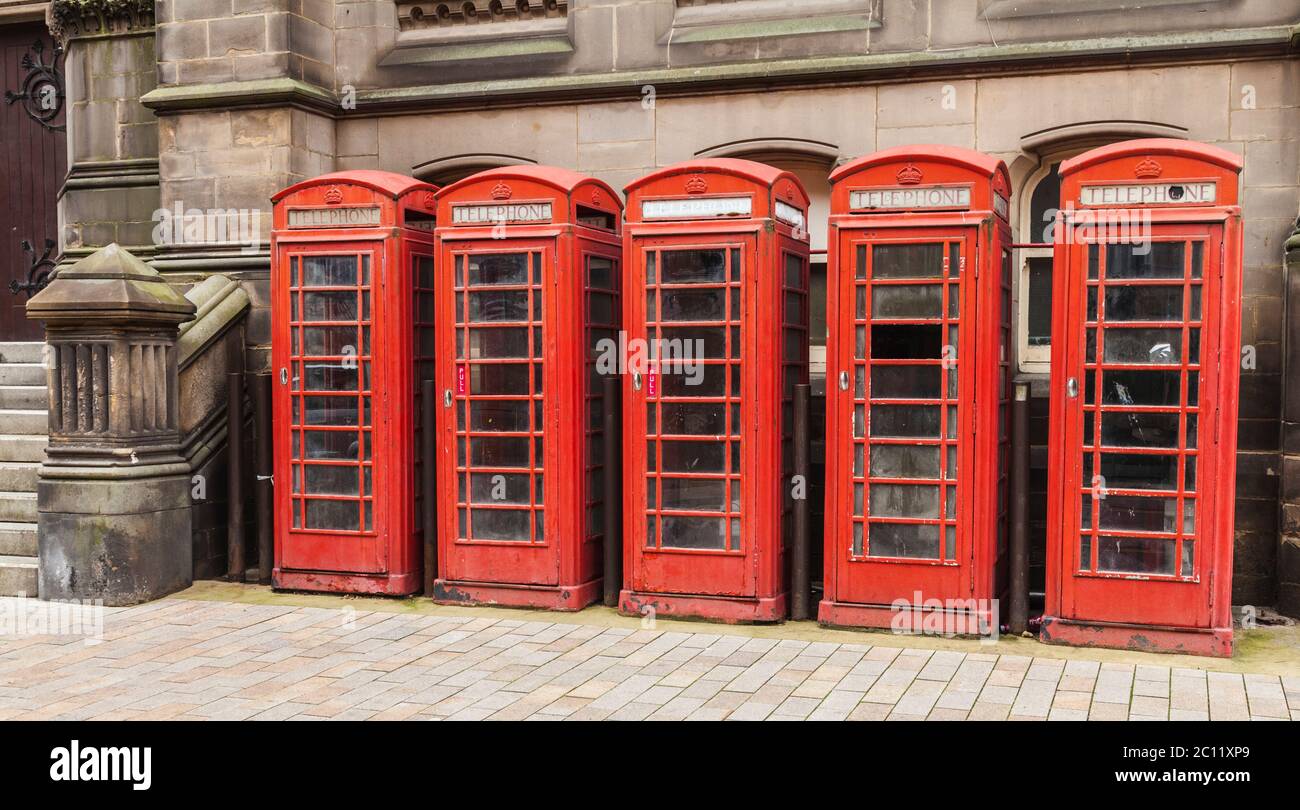 Five ,old ,red ,K6 telephone boxes in the town centre in Middlesbrough,England,UK Stock Photo