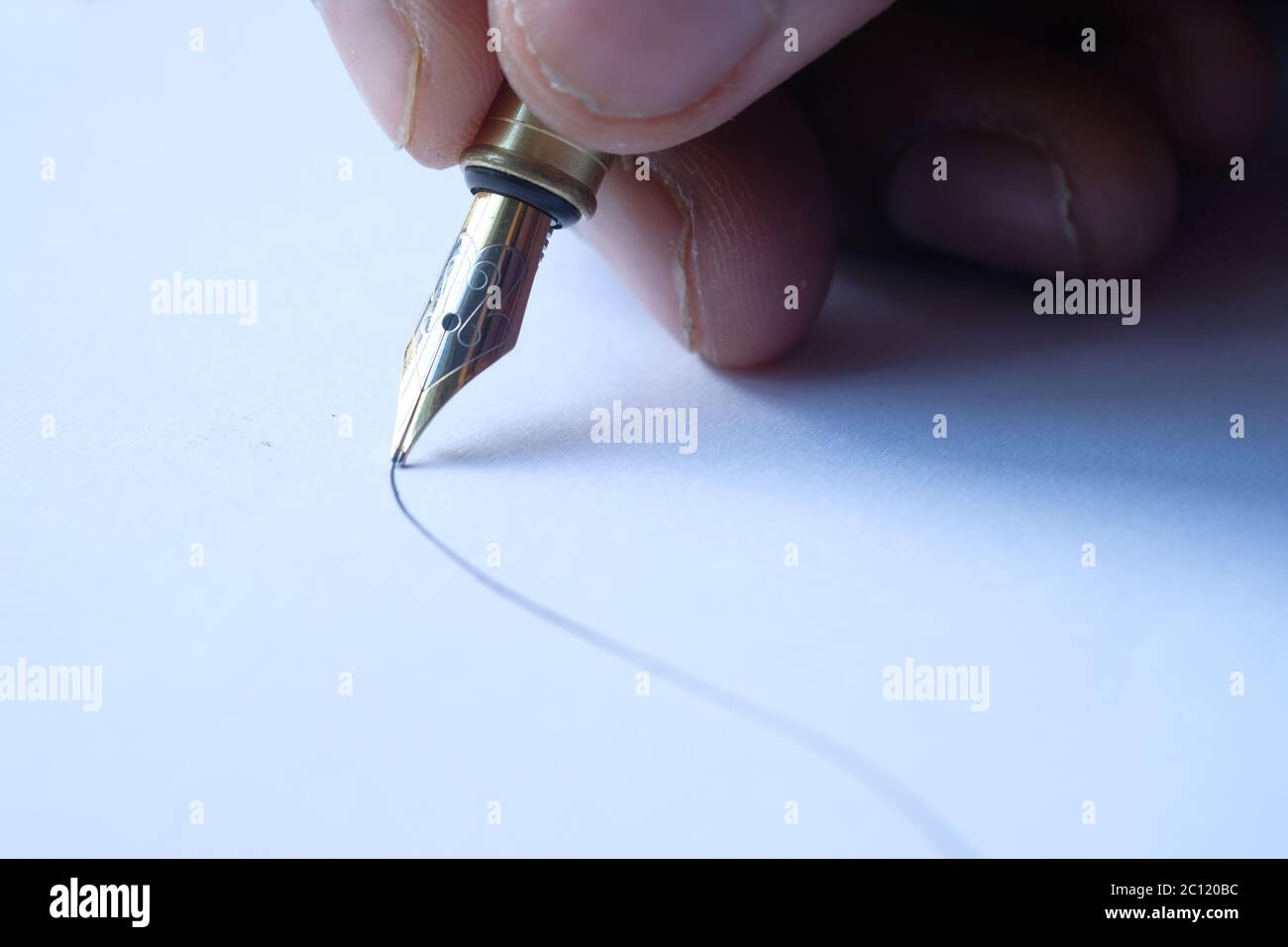 person hand writing on paper, close up  Stock Photo