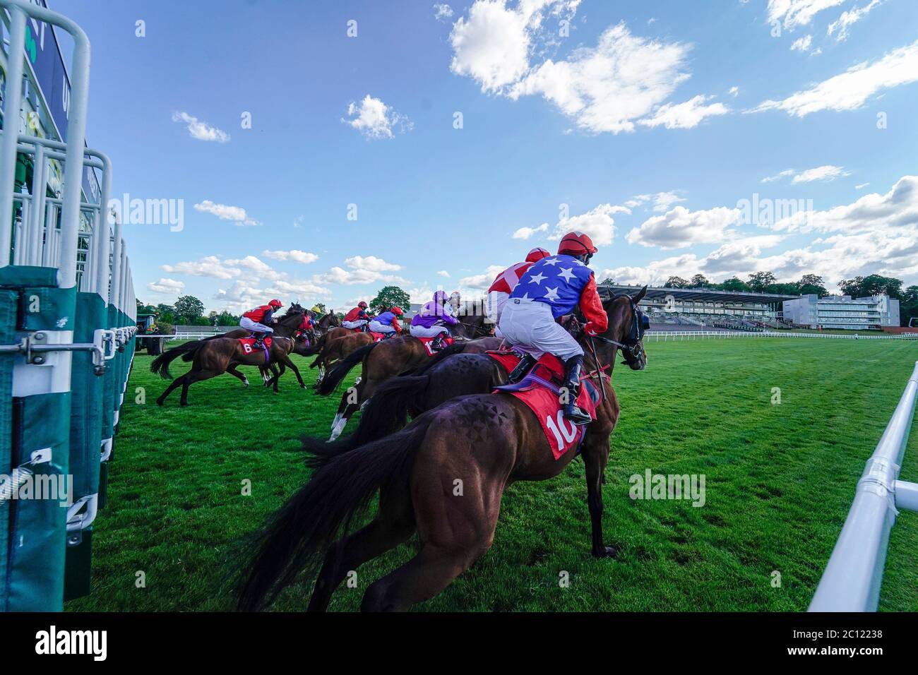 A general view as runners leave the stalls in The Oxshott Handicap at Sandown Park Racecourse. Stock Photo