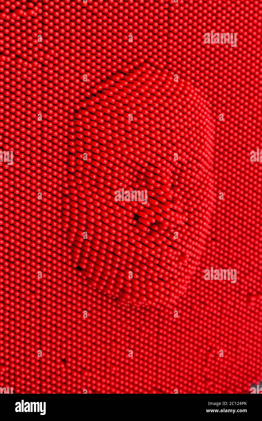 https://c8.alamy.com/comp/2C124PK/face-pressed-to-red-pin-art-board-2C124PK.jpg