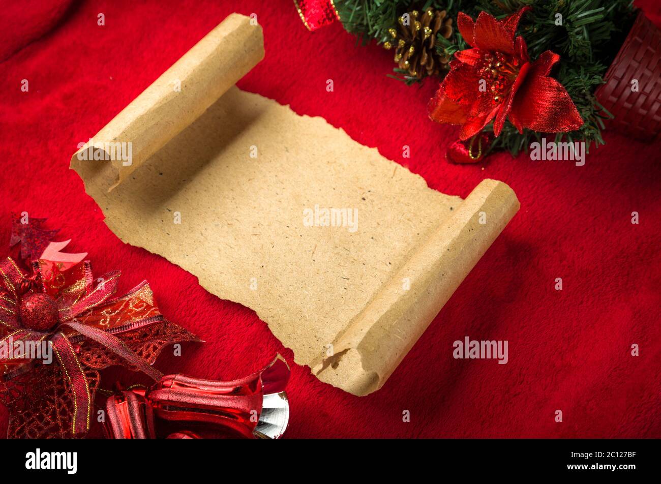 Christmas vintage paper scroll on red background Stock Photo