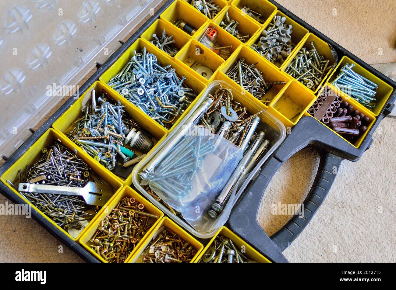 Premium Photo  Blue box with small construction objects many storage  compartments are filled with construction supplies containing screws nuts bolts  nails and other workshop tools