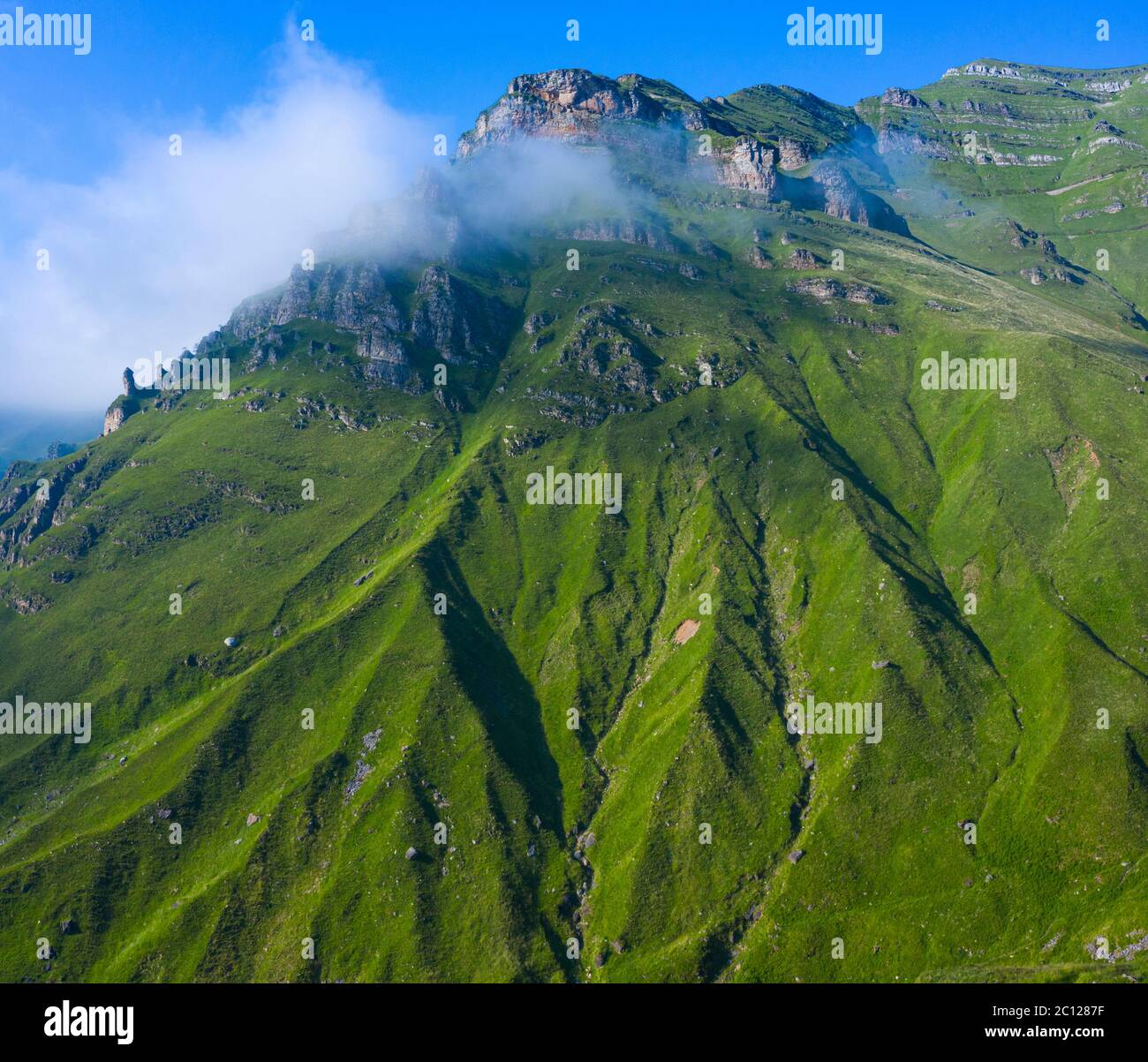 Spring landscape of mountains and meadows near the Portillo de Lunada in the Valle del Miera, Cantabria, Spain, Europe Stock Photo