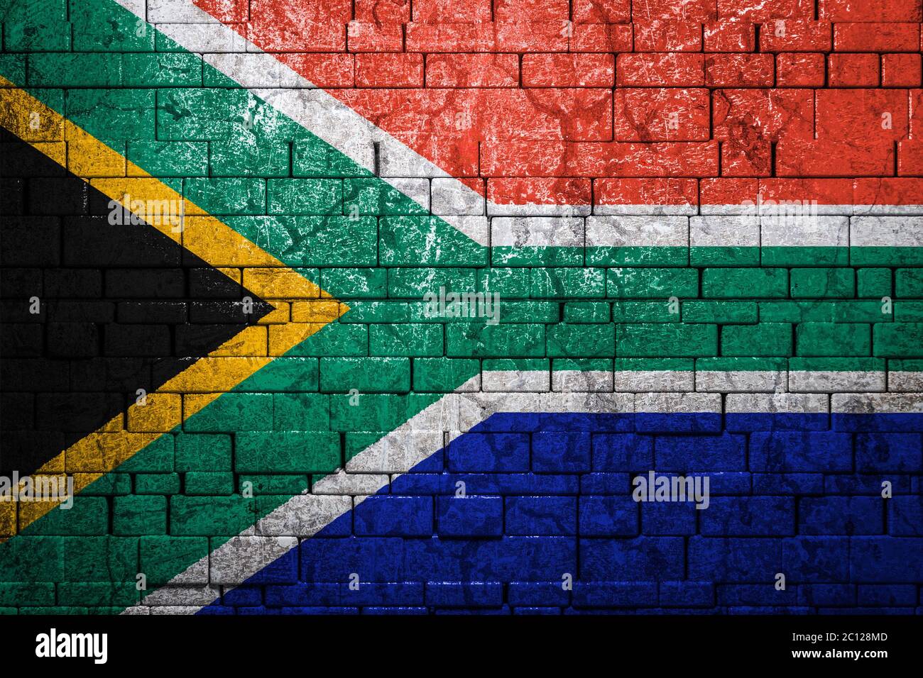 National flag of South African Republic on brick  wall background.The concept of national pride and symbol of the country. Flag  banner on  stone text Stock Photo