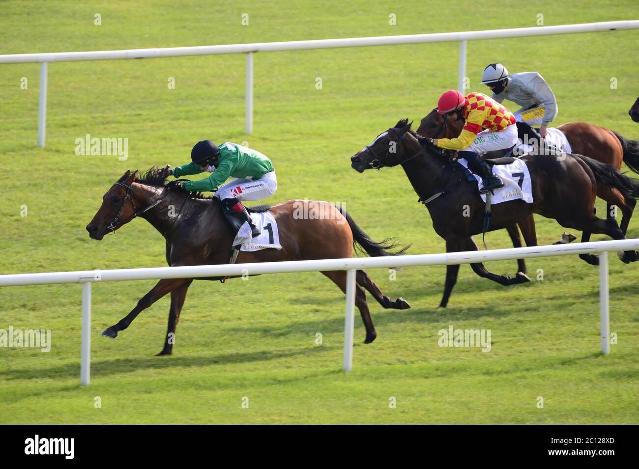 Strong Johnson ridden by Colin Keane (left) wins the Platinum Bloodstock & Eyrefield Handicap at Curragh Racecourse. Stock Photo