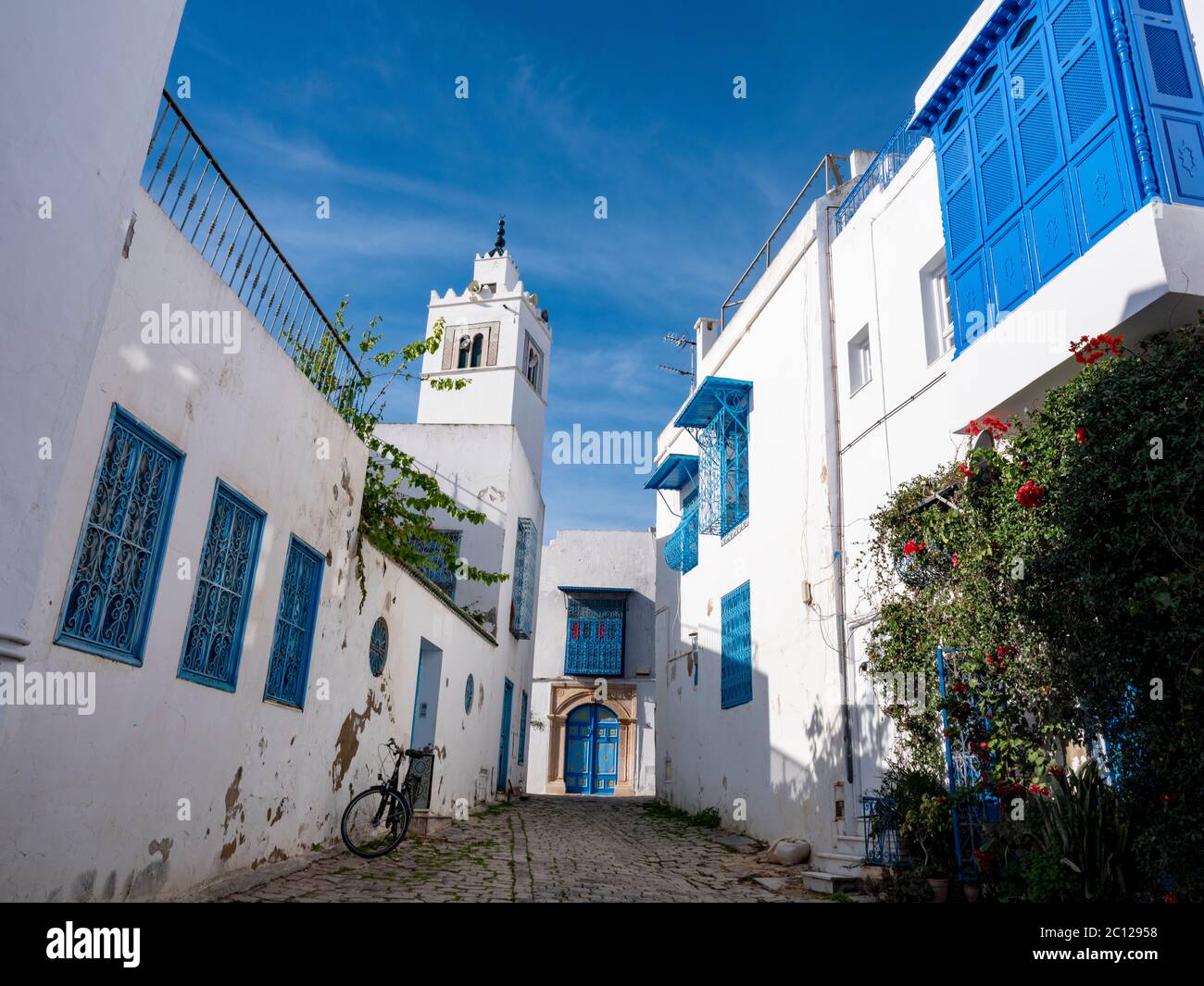 Street scene in the village of Sidi bou Said, Tunisia, known for its traditional use of blue and white colors on the facades of buildings. Stock Photo