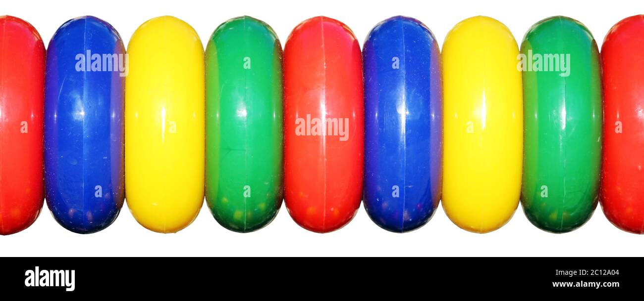 isolated colored plastic rings on the playground for games and children
