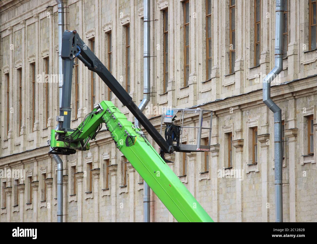 A Man Is Attempting To Lift A Crate