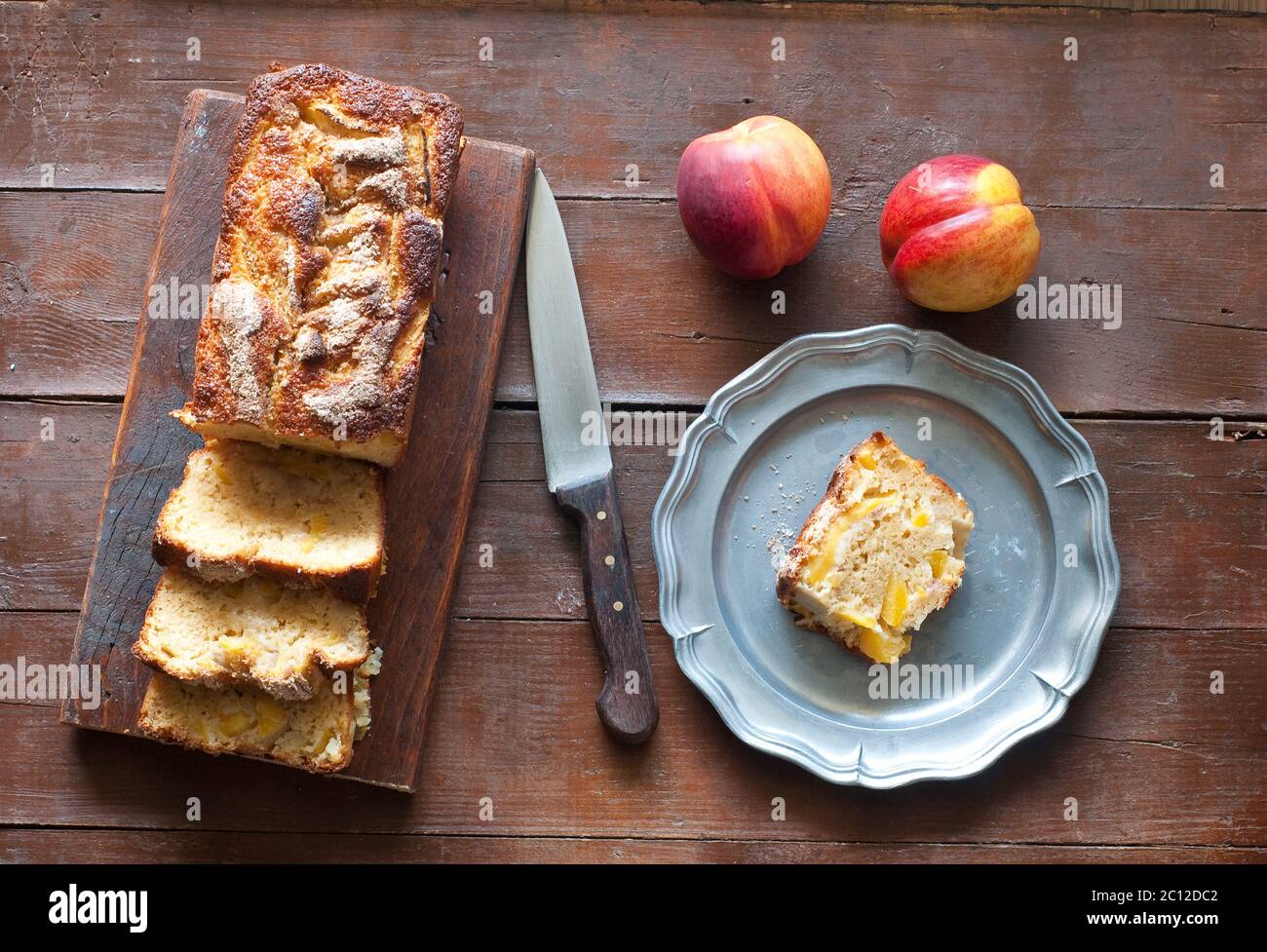 plum and yellow peaches with amaretti baked Stock Photo