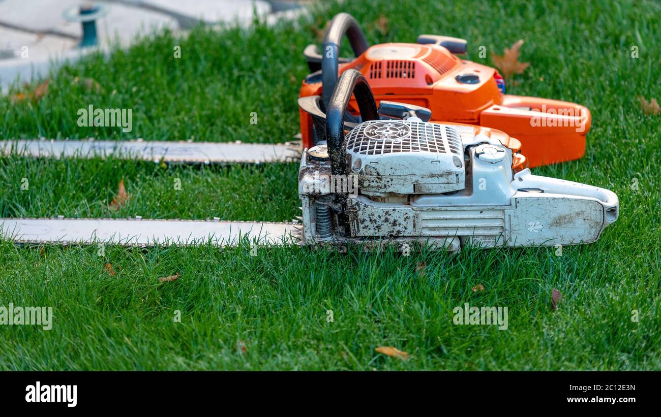 Chainsaws ready to be used for cutting down trees Stock Photo