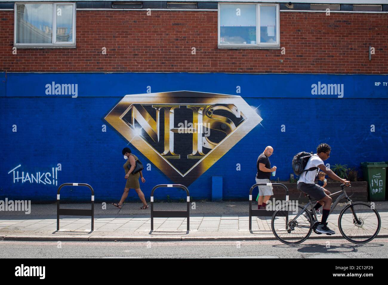 Tulse Hill, London, England. 13th June 2020. A large NHS wall mural in the form of the Superman logo painted on a blue wall in Tulse Hill in South London. (photo by Sam Mellish / Alamy Live News) Stock Photo