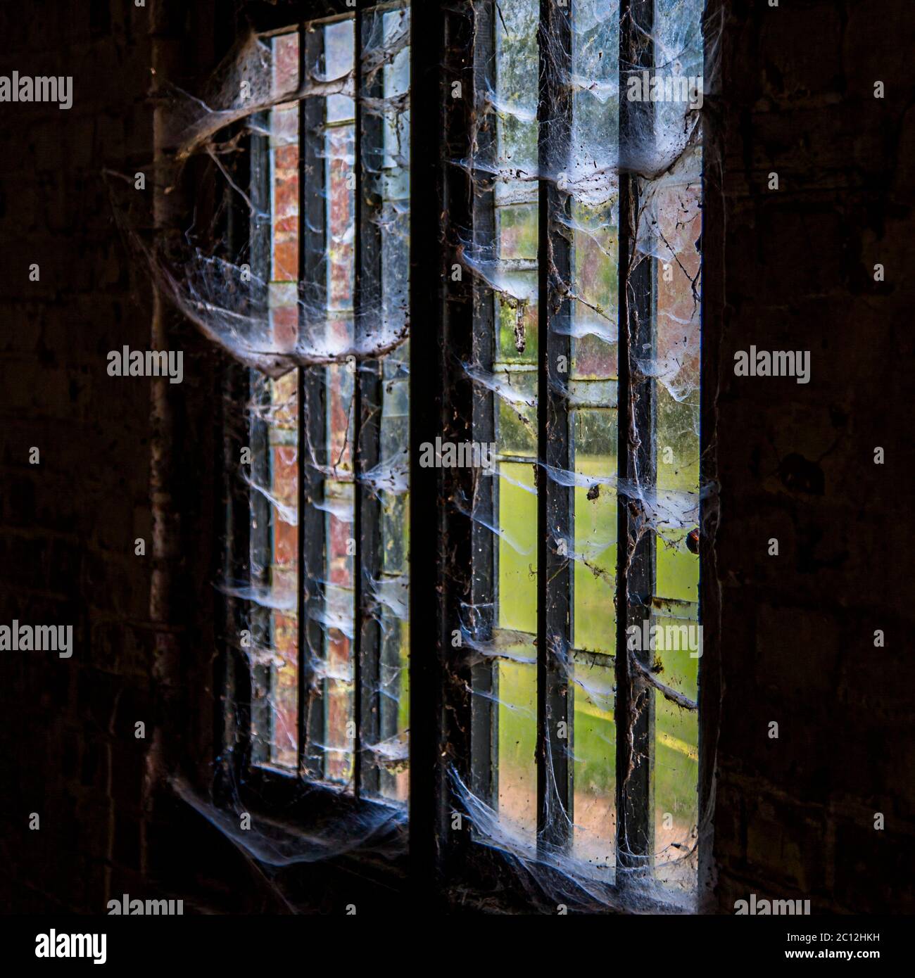 Window slit with cobwebs in Audley End House and Gardens, Saffron Walden, UK Stock Photo