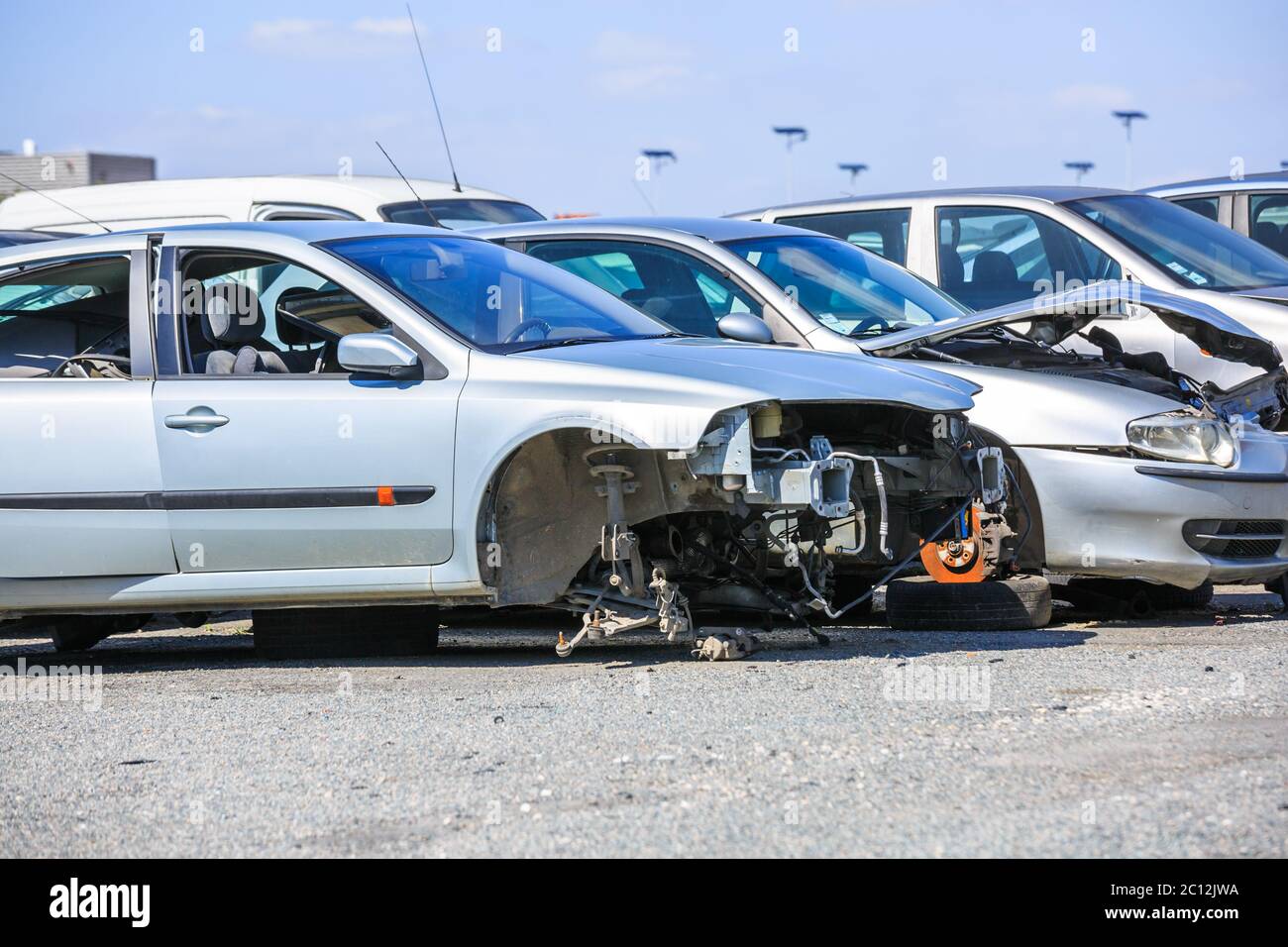 several cars in a scrap yard available for spare parts Stock Photo