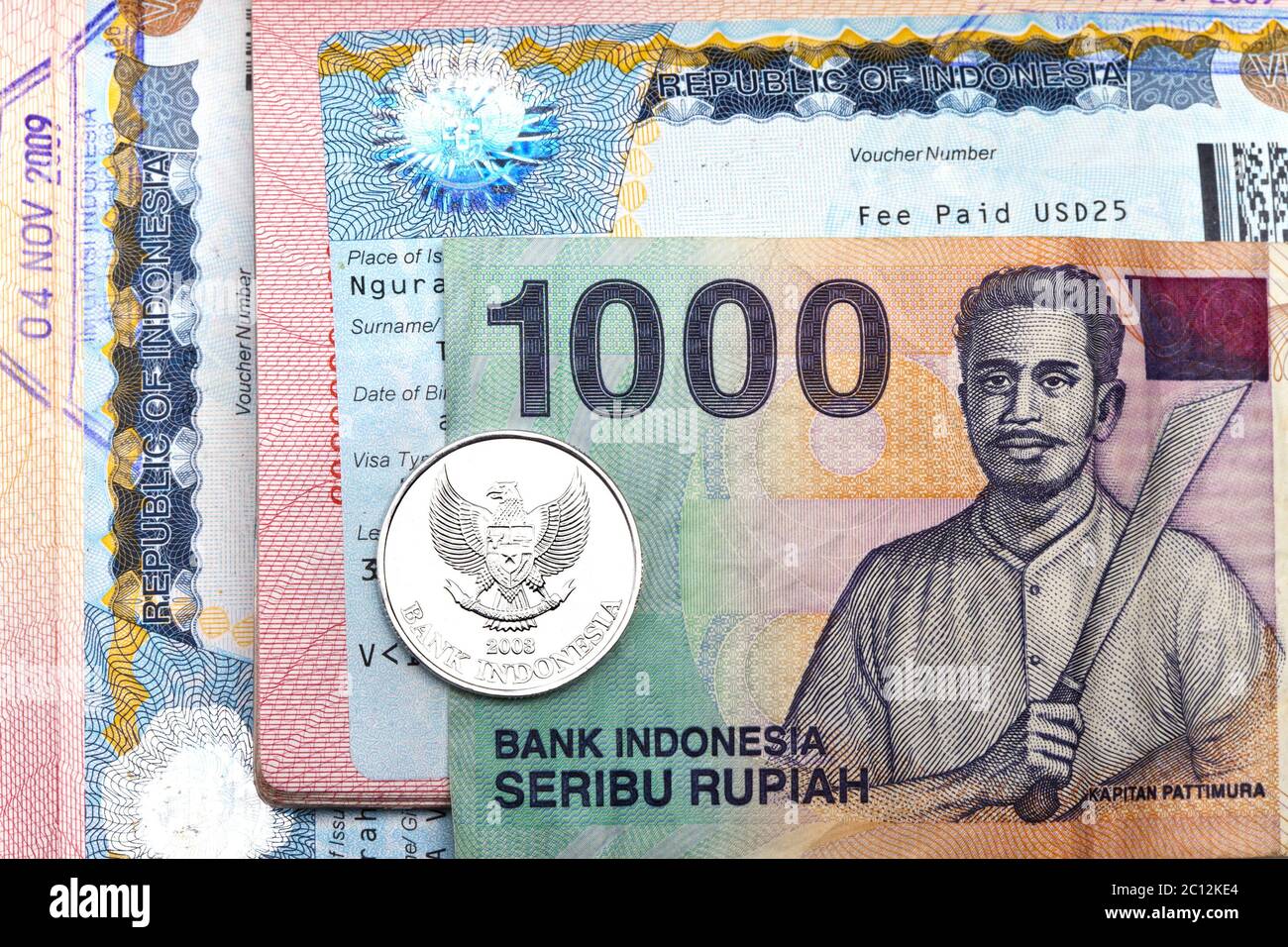 visa of Indonesia in the passport and the Indonesian rupees Stock Photo ...