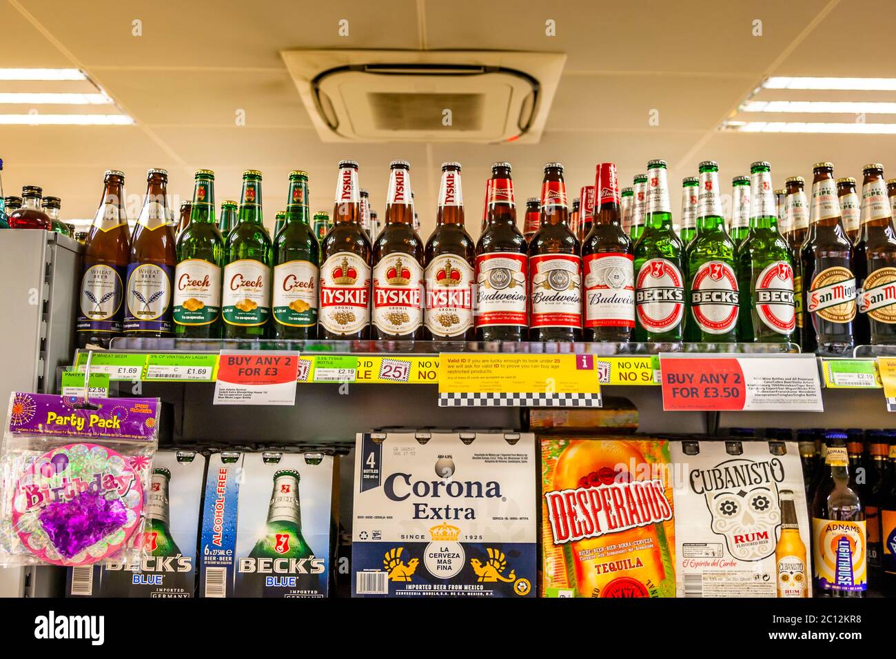 Display in English drink store with foreign beer bottles, East Suffolk, England Stock Photo