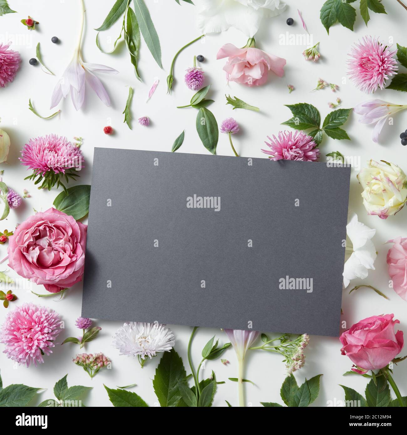 pink and white flowers with empty notebook Stock Photo