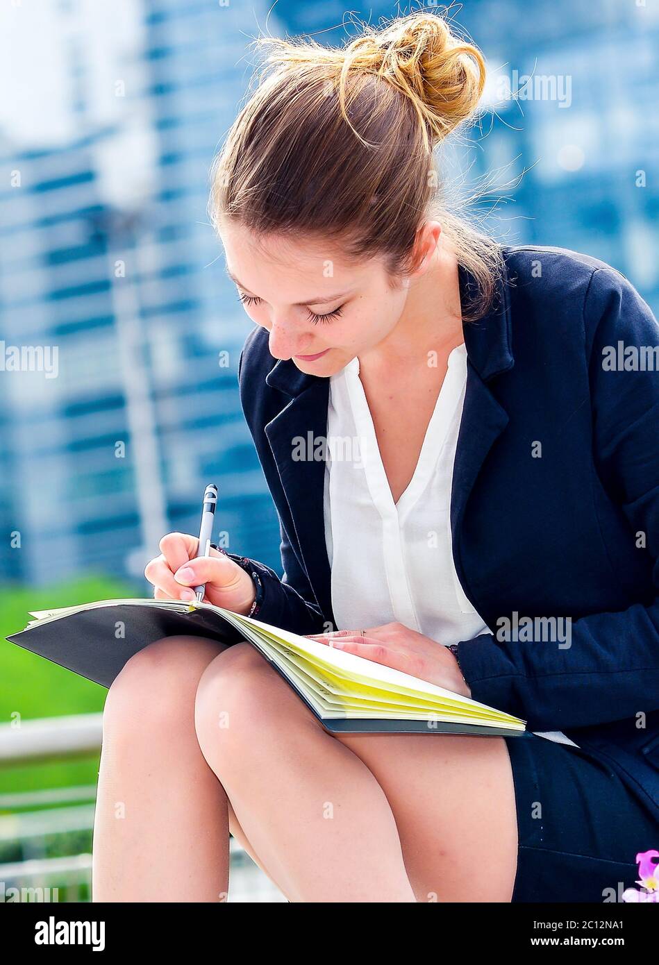 dynamic young executive taking notes on her agenda Stock Photo Alamy