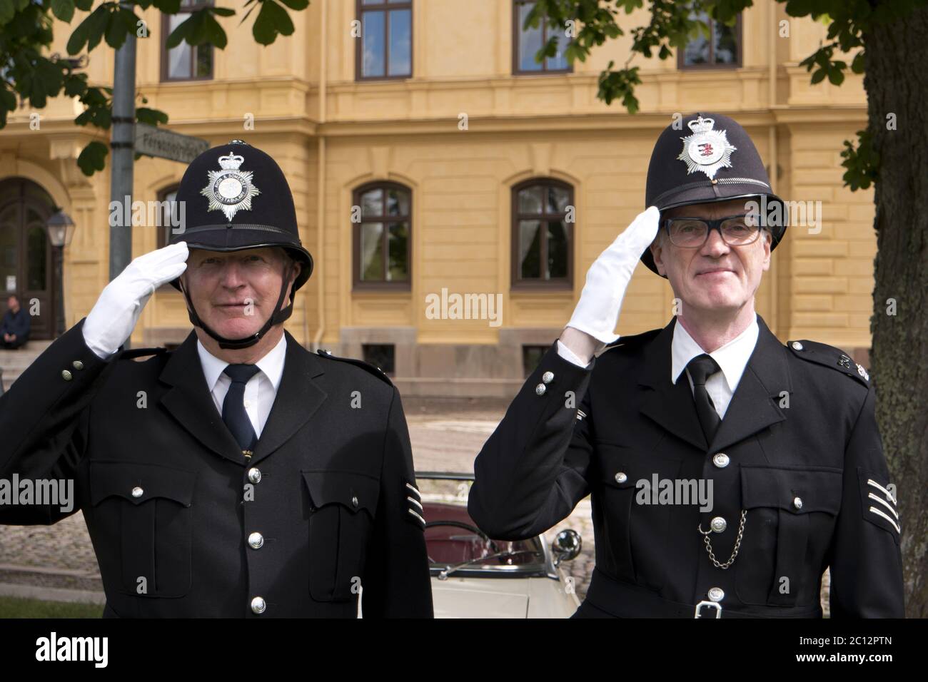 KARLSBORG, SWEDEN - AUGUST 14, 2016: Two London Bobbies posing in the Karlsborg Fortress in Sweden - editorial. Stock Photo