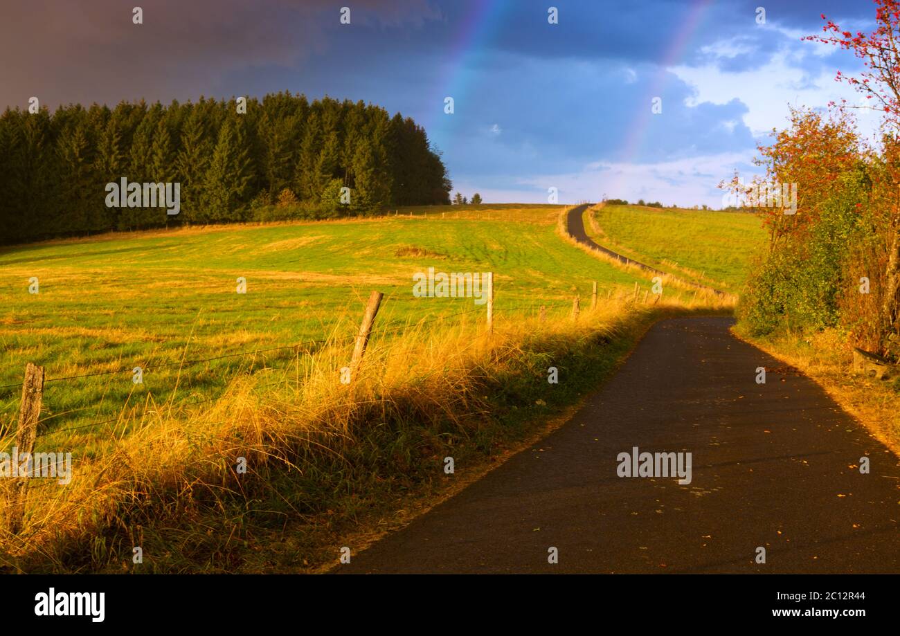 Rainbow Rural landscape with wheat field Stock Photo - Alamy