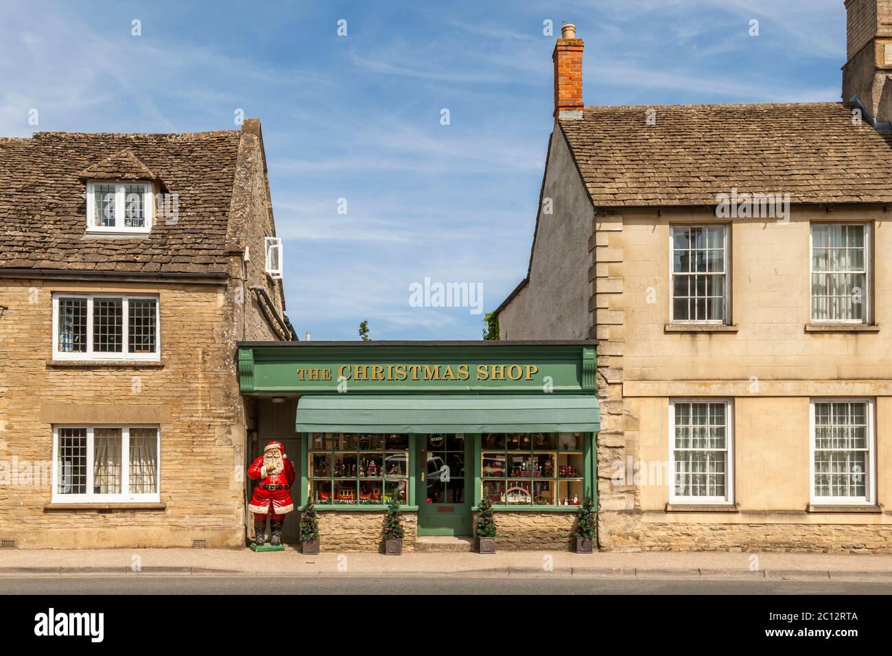 The Christmas Shop. In a small British town, a Christmas business finds itself sandwiched between two apartment buildings Stock Photo