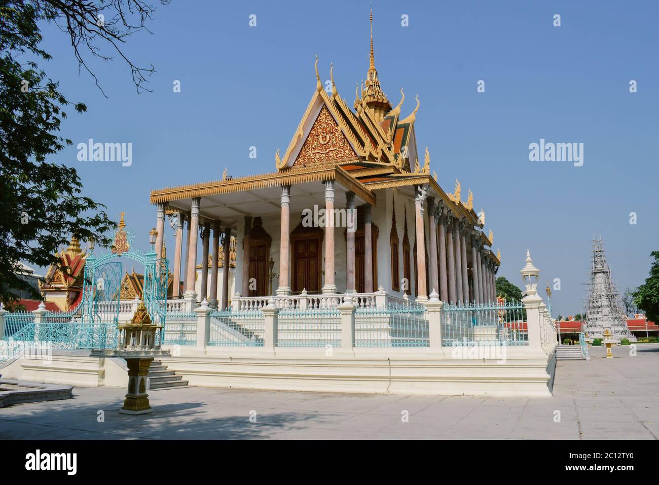 Touristy golden shrine in the Phnom Penh Royal Palace in Cambodia Stock Photo