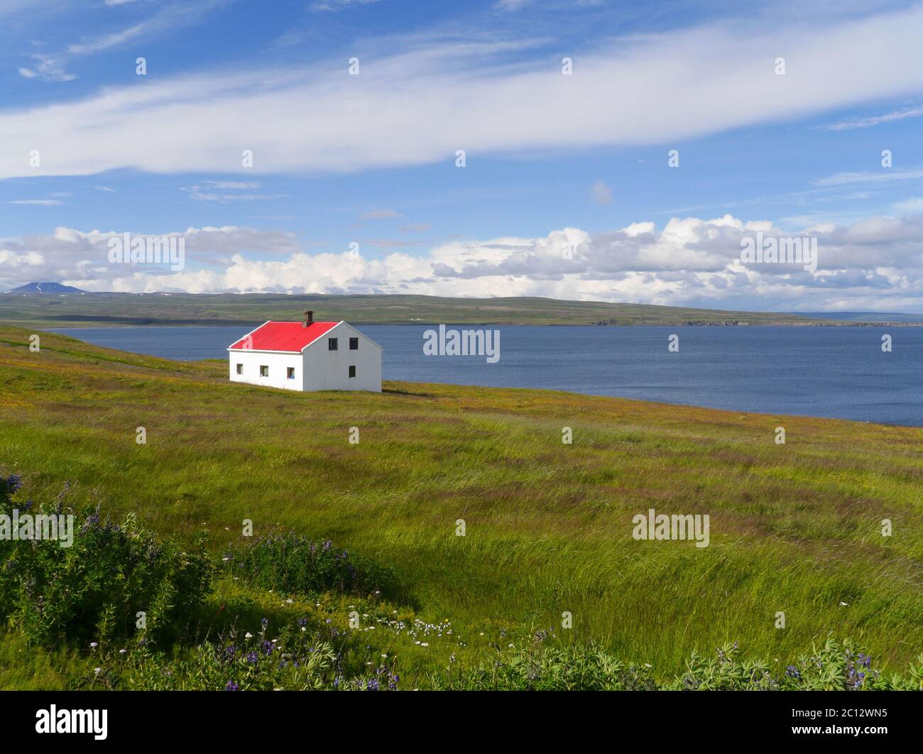 Coastal landscape with house in Iceland Stock Photo - Alamy
