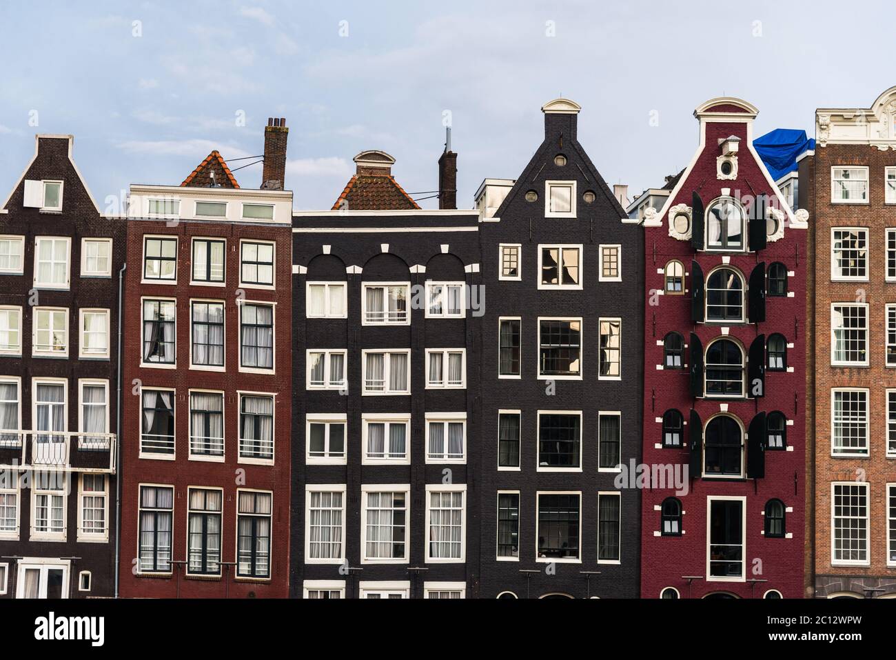 Traditional Dutch colorful houses at Damrak in Amsterdam, Netherlands. Stock Photo