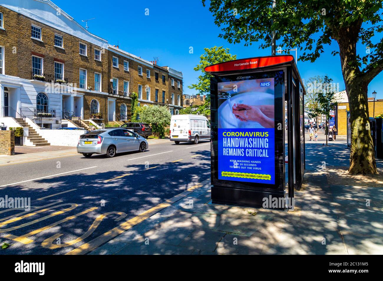 30th May 2020, London, UK - Coronavirus handwashing ad at the bus stop shelter in Chelsea, West London Stock Photo