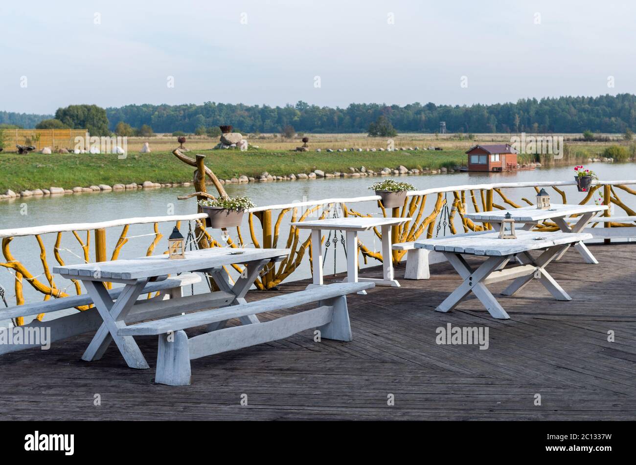 Outdoor furniture placed in the terrace by the lake Stock Photo