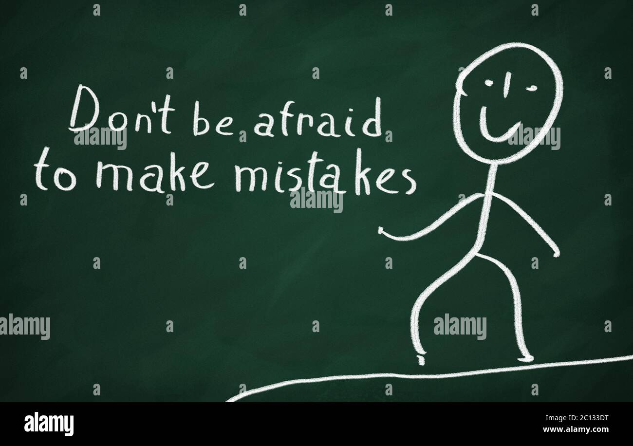 On the blackboard draw character and write Don't be afraid to make mistakes Stock Photo