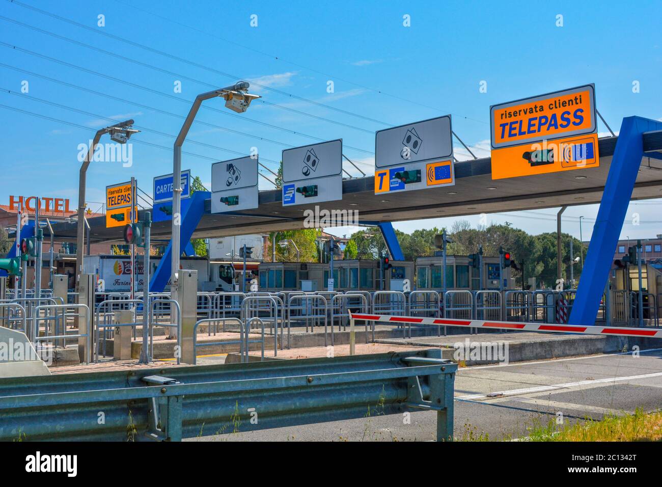 An italian highway toll barrier (autostrade italiane). Typical tollboth from italian Autostrada where cars and trucks have to pay toll when exiting Stock Photo