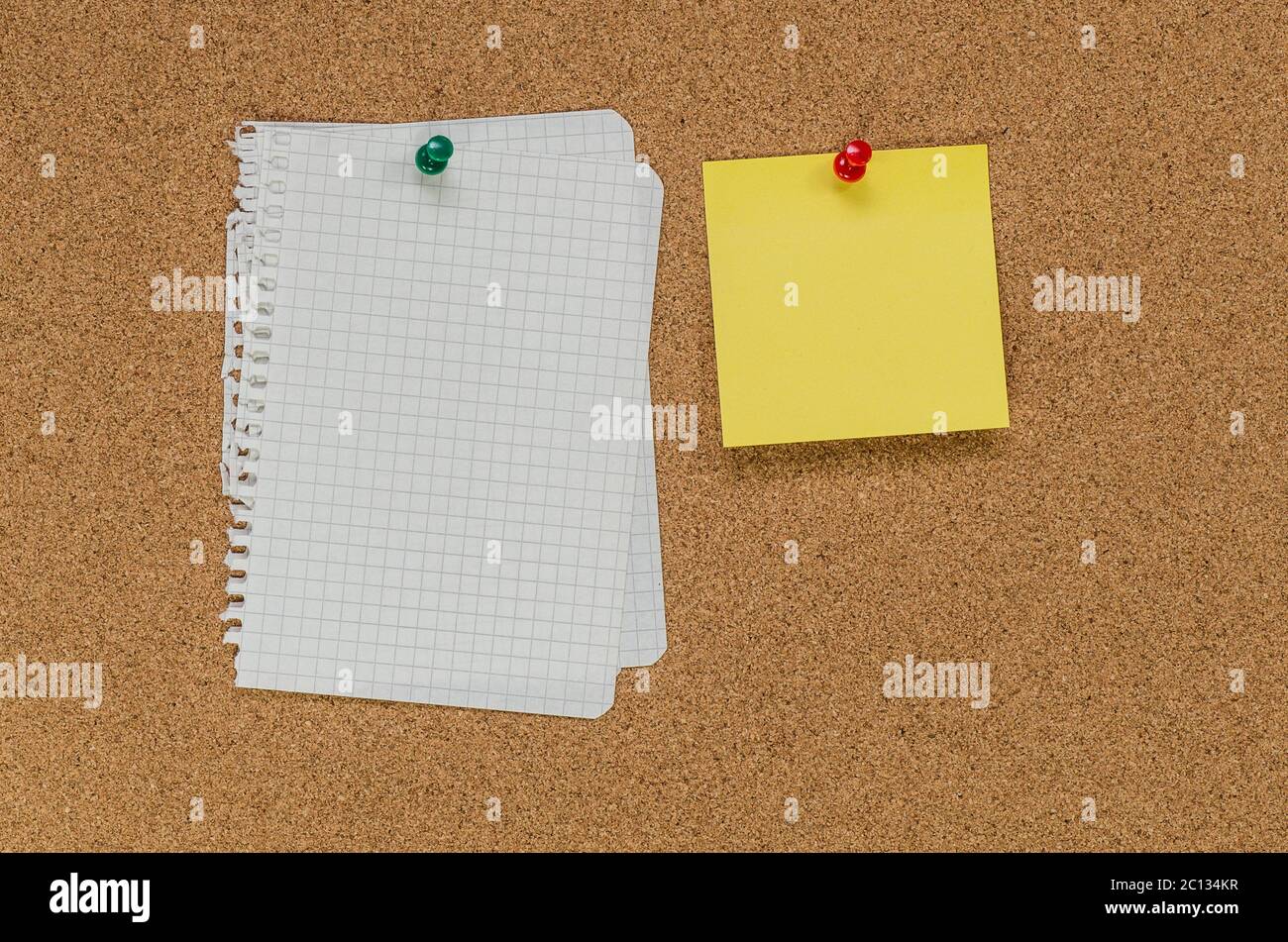 Cork board and note papers, close up image Stock Photo