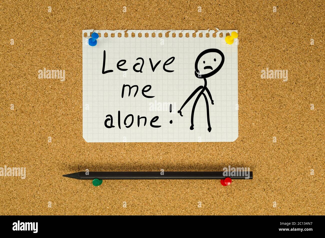 Leave me alone text note message pin on bulletin board Stock Photo ...