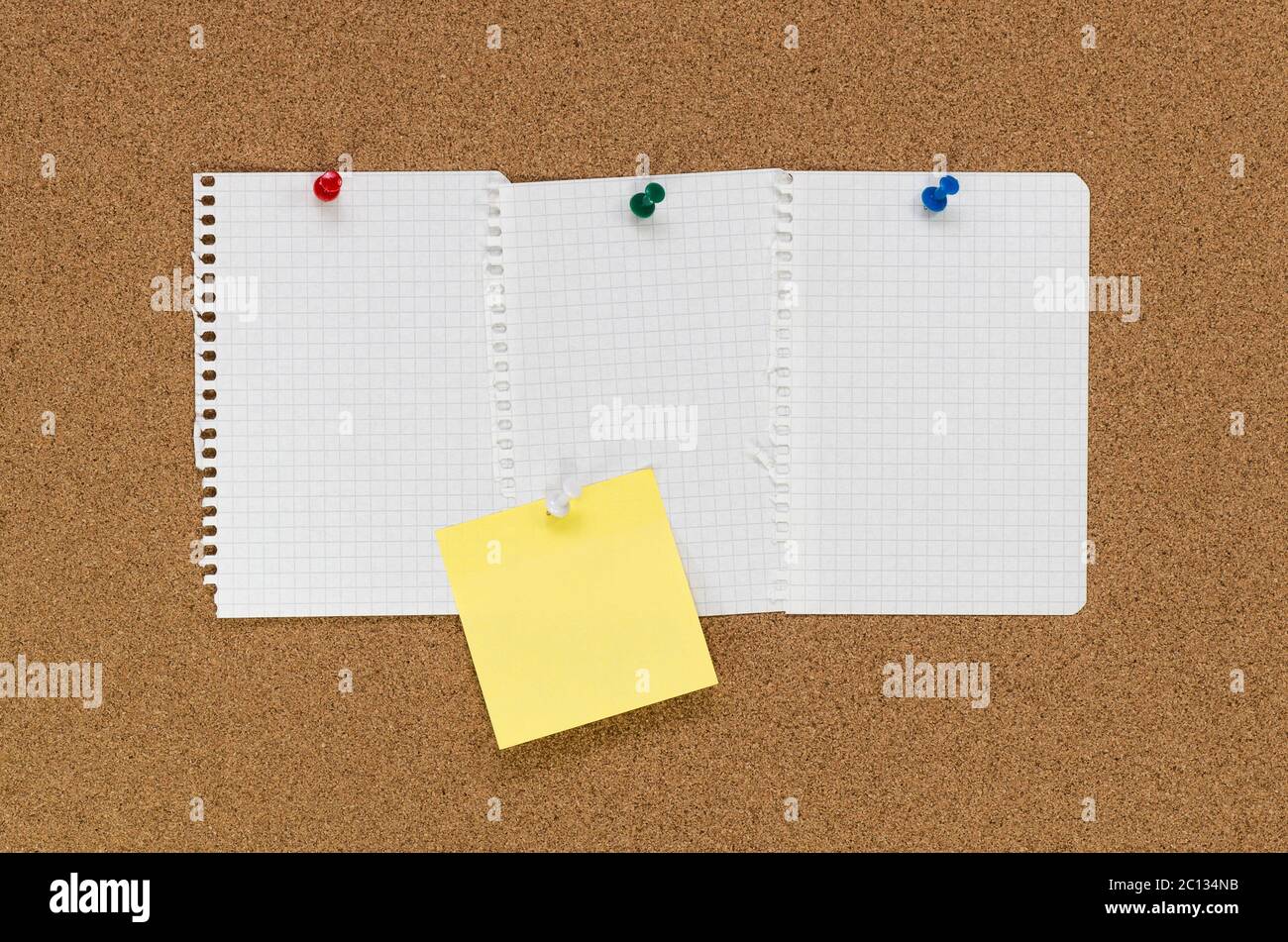 Cork board and note papers, close up image Stock Photo