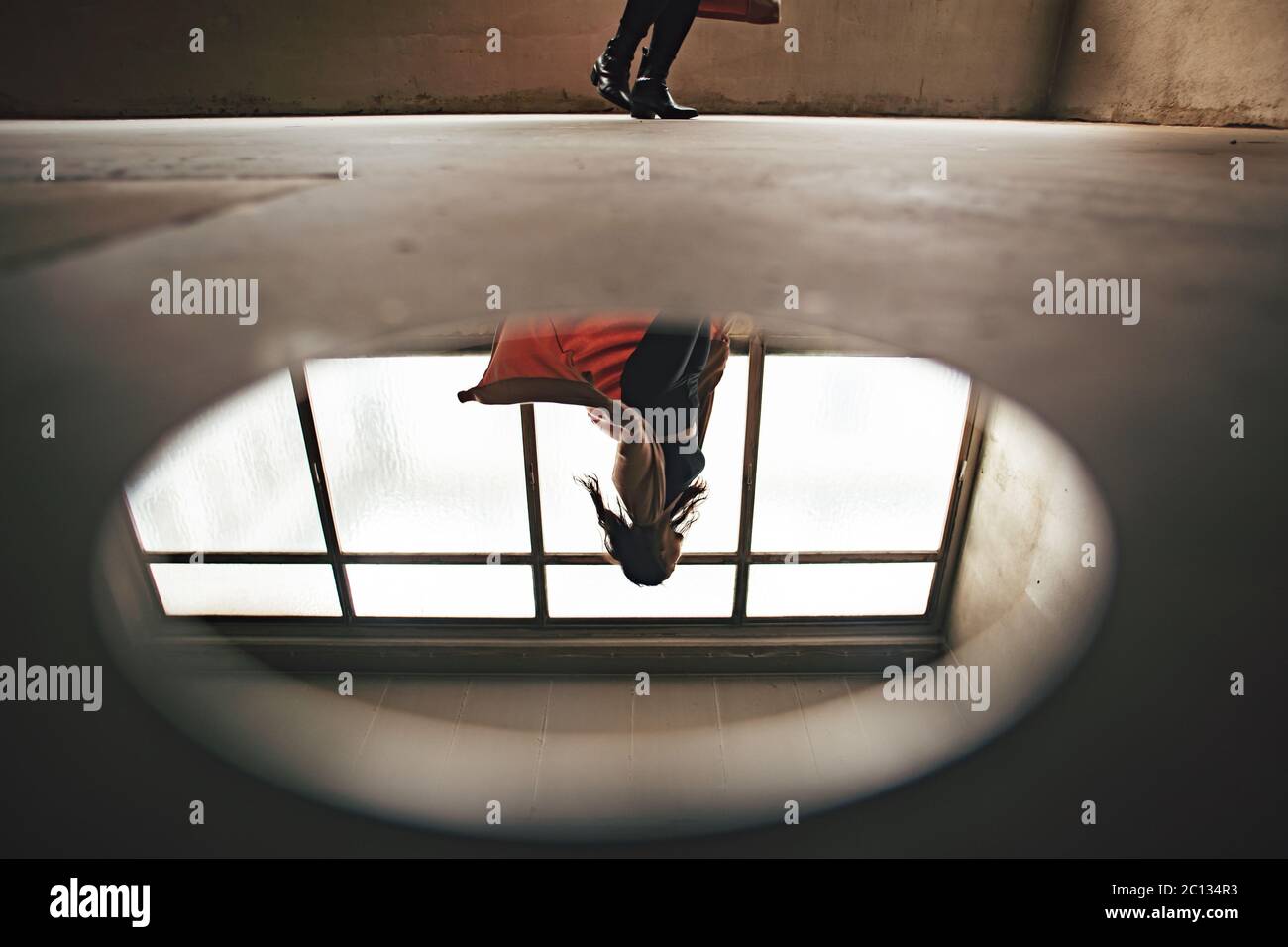 dancer in front of a window