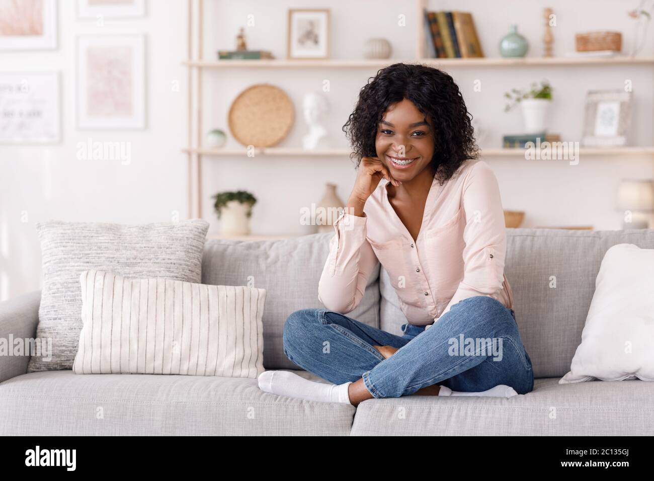 Happy African Girl Posing In Stylish Living Room Interior, Smiling At ...