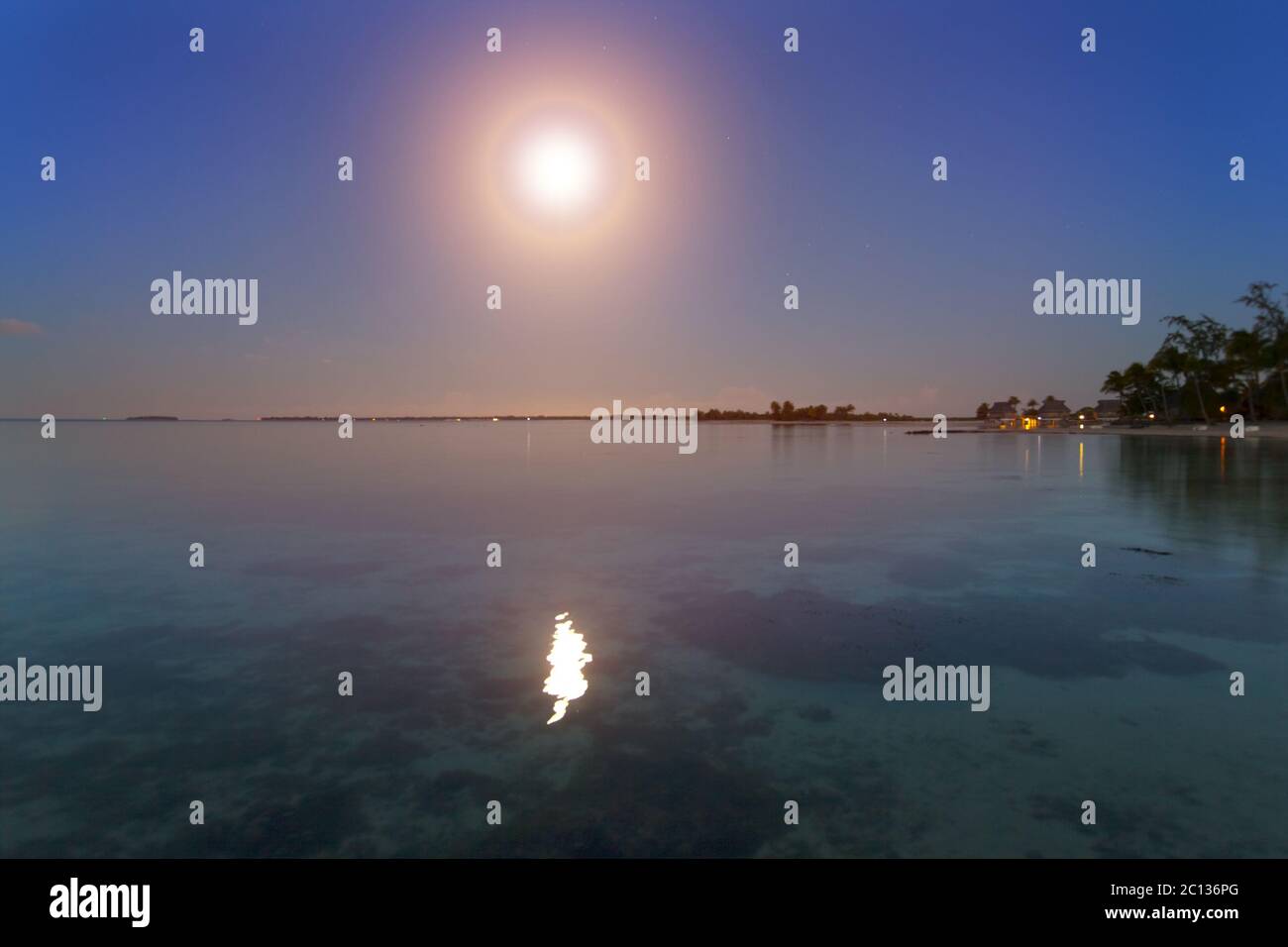 Night. The moon over the sea and reflection in water. Stock Photo