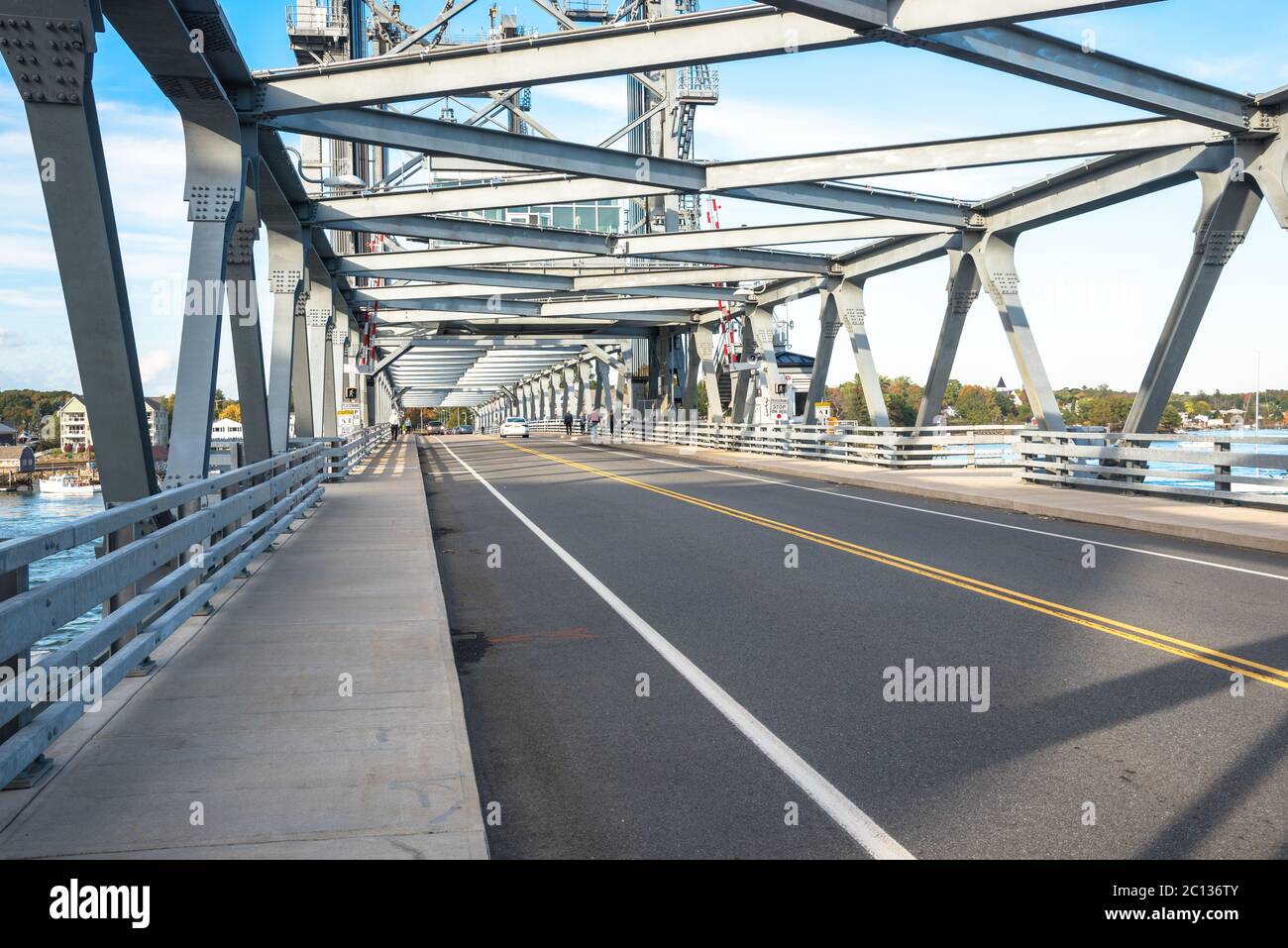 VErtical lift bridge with walkways on both sides of the road on a clear autumn day Stock Photo