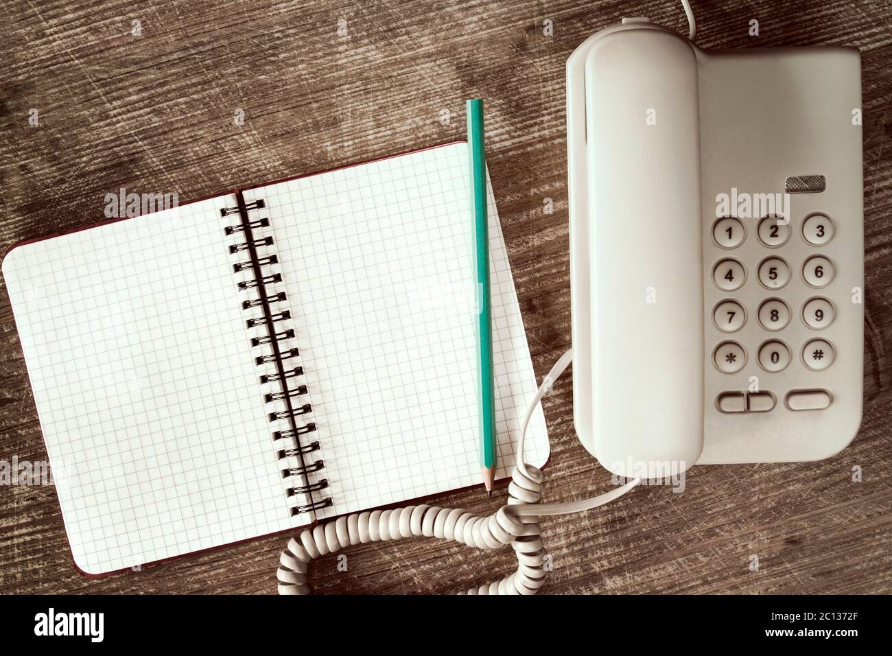 Touch tone telephone and notebook Stock Photo Alamy