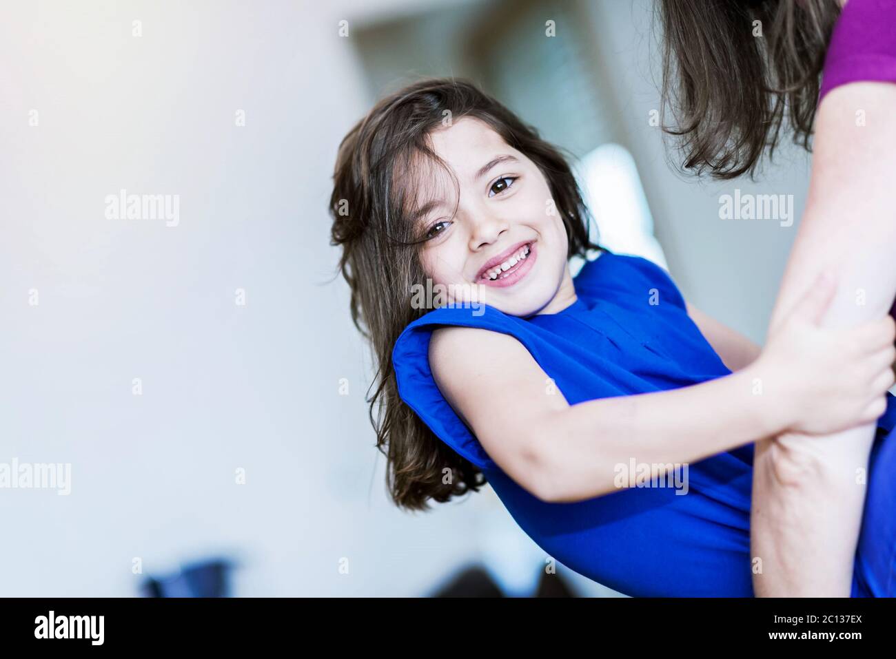 complicity between a very cute little girl and her mother Stock Photo