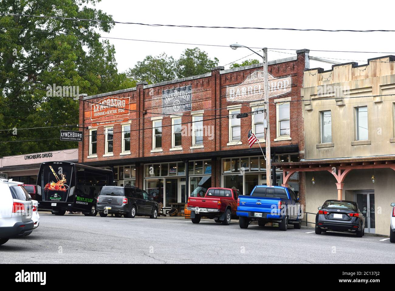 Lynchburg, TN, USA - September 23, 2019:  Drug store, Lynchburg Hardware and General Store, Jack Daniels and Barrel shop in the traditional commercial Stock Photo