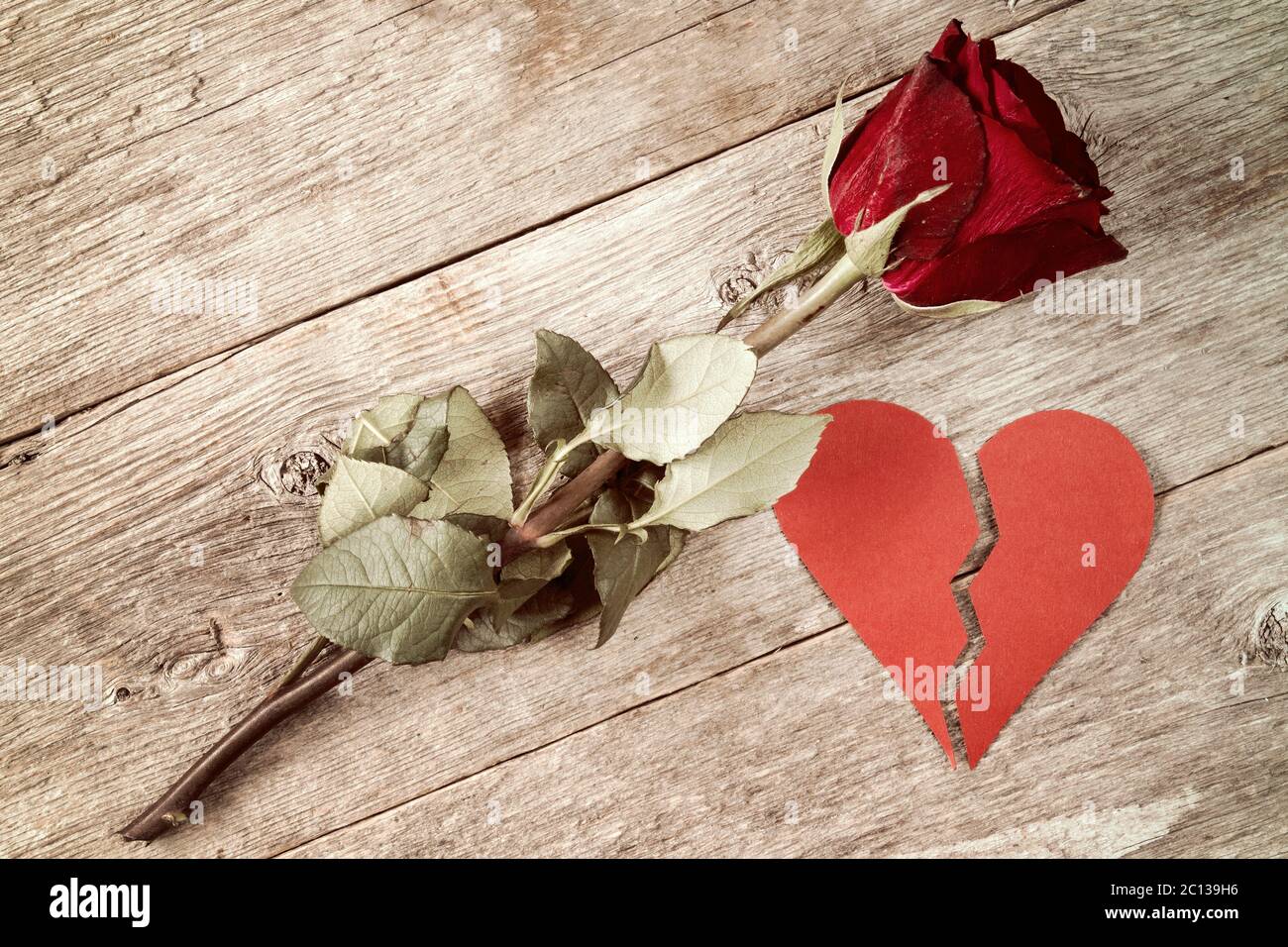 Red broken heart and old rose Stock Photo Alamy