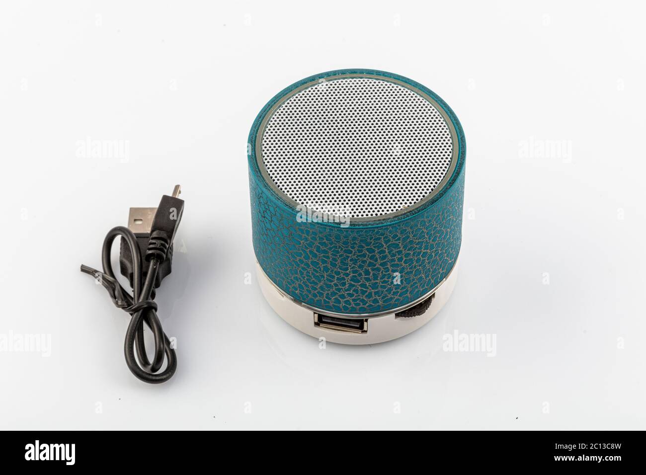 Modern Bluetooth speaker, mini Bluetooth speaker. Mini portable Bluetooth speaker on white backdrop. Stock Photo